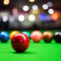 Close-up of snooker balls on the baize